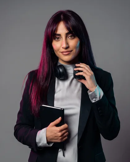 Portrait of Leila Haddad, a generated character with long black-cherry hair, headphones around her neck and a black notebook